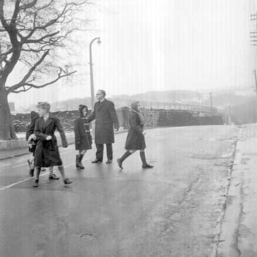 View of Meltham - children crossing the road 	