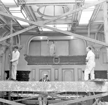 Workmen redecorating the Council Chamber atthe Town Hall, Huddersfield 	