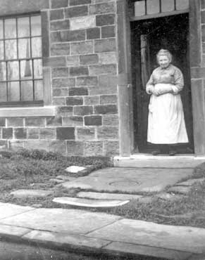 Woman outside house, Quarry Road, Gomersal