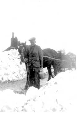Bob Pearce delivering milk in snow, Towngate, Shelley