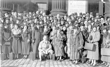 Group of people from Kirkheaton outside Huddersfield Station, going on trip to Blackpool
