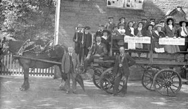 Group of children on horse and cart 'Harmonic Revived Lodge' on banners