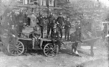 Firemen on horse and cart fire engine