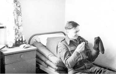 National Service RAF: Sac Murray darning socks in barracks, RAF Gutersloh, West Germany