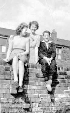 Harold Laycock with Mum and sister, wall opposite Holdroyd Park