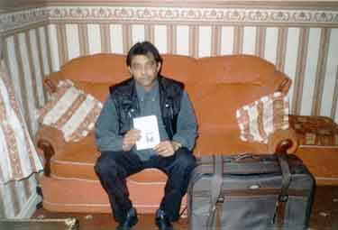 Raja Sultan with suitcase and passport (for Kim Strickson Project)
