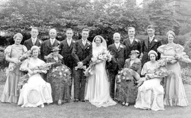 Wedding of Mr & Mrs Harold Mann - featuring Florence Hodgson, bridesmaid (seated 2nd right) who made a tablecloth as a wedding gift