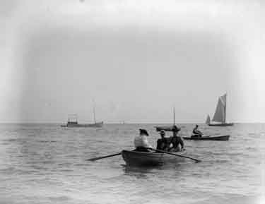 Criccieth, three ladies in a boat, one rowing