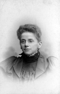 Portrait of a Young Woman Wearing Glasses. 