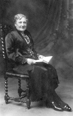 Portrait of a Older Woman, Seated and holding an Open Book. 