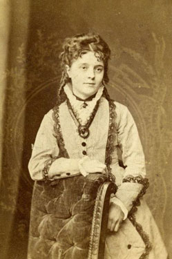 Portrait of a Young Woman Leaning on a Chair. 