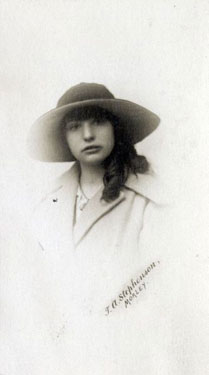 Portrait of a young girl wearing a hat.