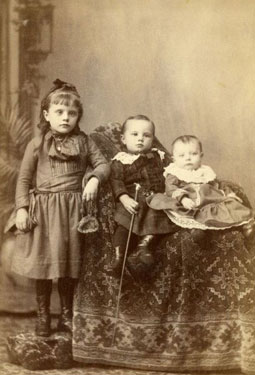 Portrait of three young children.