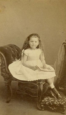 Portrait of a young girl with book.