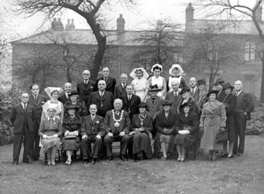 A group photograph, including nurses and dignitaries.