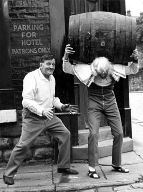 Jimmy Saville helps Ernest Baldwin get his ale in (story from Janet Brook).