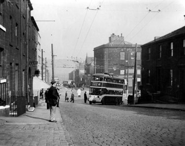 The junction of Chapel Hill and Manchester Road viewed from the former South Parade, Huddersfield - showing trolleybus No. 130 using the temporary diversion during the closure of Huddersfield's main street for reconstruction during the months of April, May and June of 1939. All the property, with the exception of the then new Co-op building to the far left of the image, are now demolished and the road junction has seen many changes over the years.