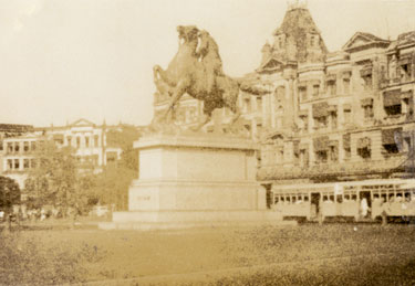Wartime Archive of Reg Stone of Skelmanthorpe: Statue with a tram in the background at the junction of Chowringhee Road and Park Street, Calcutta. “Firpos Restaurant was situated further down this street, where troops were given mementos”, Reg Stone.