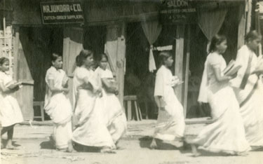 Wartime Archive of Reg Stone of Skelmanthorpe: “Some of the happier moments” – Girls from the near by Ladies’ Collage walking along Comilla’s Main Street, East Bengal.