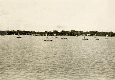 Wartime Archive of Reg Stone of Skelmanthorpe: Sailing in Monsoon Season on the Brahmaputra River, Dacca, (Dhaka), Bengal - A view of a group of sailing boats at the joining of the Ganges and Brahmaputra Rivers.