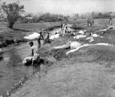 Royal Air Force 1543805 R.O. Stone East Bengal and Burma 1943-1946: Black and White Negatives of various photographs taken over that period – Hill Leave, Maymyo (Pyin U Lwin), Burma – “Camp Helpers on Wash Day.”