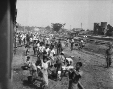Royal Air Force 1543805 R.O. Stone East Bengal and Burma 1943-1946: Black and White Negatives of various photographs taken over that period – Taking the Rangoon Railway to Mandalay, via Pegu and Thazi – Approaching the junction town of Thazi, “Fruit Sellers and Beggars Galore”.