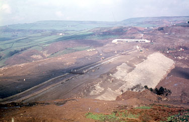 The construction of the first segment of the Yorkshire section of the M62 motorway, situated between the county boundary of Saddleworth Moor and Outlane - Scammonden embankment/dam.