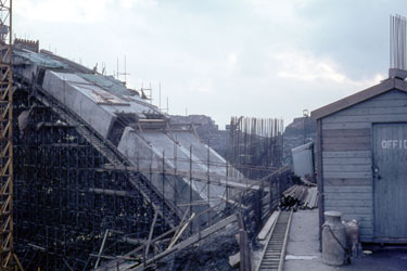 The construction of the first segment of the Yorkshire section of the M62 motorway, situated between the county boundary of Saddleworth Moor and Outlane - Scammonden Bridge, the centering of the arch aided by scaffolding.