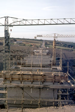 The construction of the first segment of the Yorkshire section of the M62 motorway, situated between the county boundary of Saddleworth Moor and Outlane - Scammonden Bridge, the centring of the arch aided by scaffolding.
