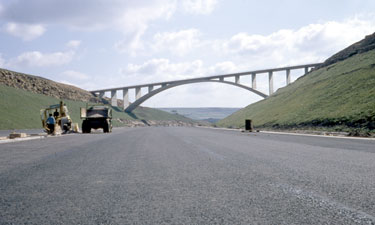 The construction of the first segment of the Yorkshire section of the M62 motorway, situated between the county boundary of Saddleworth Moor and Outlane - Scammonden Bridge.