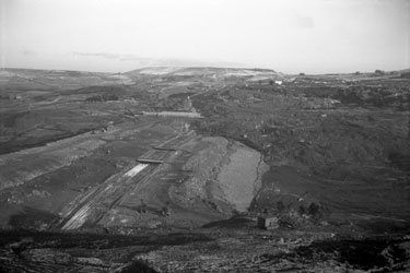 The construction of the first segment of the Yorkshire section of the M62 motorway, situated between the county boundary of Saddleworth Moor and Outlane - Scammonden dam/embankment.