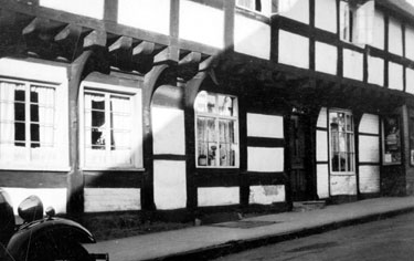 Photo Album Containing Various Images: A row of half-timbered cottages, Weobley, Herefordshire.