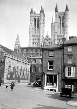 Photo Album Containing Various Images: Lincoln - Street Scene, with the Cathedral in the background.