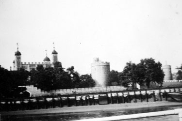 Photo Album Containing Various Images: Tower of London viewed from the River Thames, with a view of the water-gate known as "Traitors' Gate".