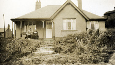 The Bungalow, Shelley - Mr John Beddard (former Headmaster of Shelley Council School) and his wife Sarah Jane, seated on the veranda.