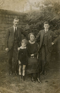 Mr and Mrs Hall with their two children Fredrick and Burt, in the garden of No. 32 North Road, Ravensthorpe.