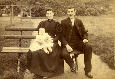 Charles Whitwam and Sarah Elizabeth Whitwam (née Taylor), seated with their baby.