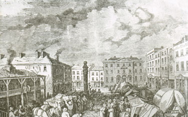 Talk given by Austin Holroyd: "What's this dull town to me ......" Market Place, Huddersfield – “We start at the centre of things at the Market Place. This etching bears the name Fountain and must have been the artist’s impression of the Town Centre about 1800. The George Inn stands across the North end of the square. When John Williams Street was built in 1850 it was removed. The shops on the left have been altered slightly, but most have been there almost 200 years. It is obvious that the smoke abatement act had not come into force by the smoke pouring out of the chimneys. In spite of our weather, chimneys last a long time in Huddersfield, and are very useful for identifying buildings. The artist shows us a gentleman in the stocks in the centre of the picture.”