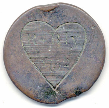 A bronze halfpenny coin of William III which has been polished on one side in order to produce a love token; on one side is the name R. Bly with the date 1752, on the other the original coin, much worn.