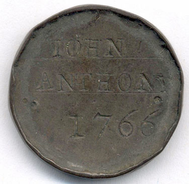 A bronze halfpenny coin which has been polished on both sides in order to produce a memento, the edge has also been raised; on one side is the name John Anthony, 1766, the other side is blank.