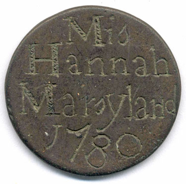 A bronze halfpenny coin which has been polished on both sides in order to produce a love token; on one side is the name Hannah Maryland with the date 1780, on the other side are the initials I S either side of a simple floral design.