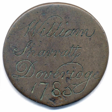A bronze George II (probably) halfpenny coin which has been polished on both sides in order to produce a love token; on one side is the name William Sharratt, plus Doveridge, which is almost certainly the place-name; with the 1785, the other side is blank.