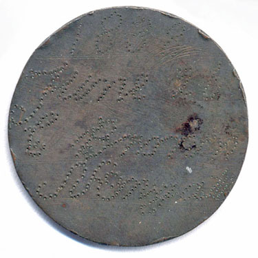 A bronze George III halfpenny coin which has been polished on both sides in order to produce a love token; on one side are punched the words '1838, June 26, C Brown . . . . . '; on the other side it says ' will come out of prison Dec 17'.