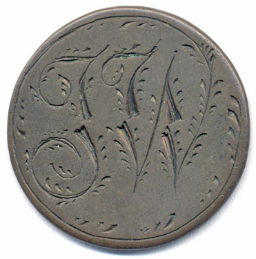 A bronze coin which has been smoothed to make a love token; one side has the letters TW (probably); the other side is blank. 