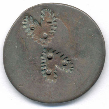 A bronze halfpenny (probably) coin which has been smoothed to make a love token; one side has two stamped hearts, the other side is blank.