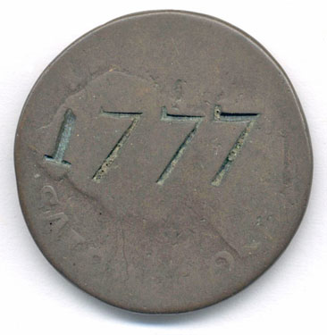 A bronze George II halfpenny coin which has been smoothed to make a love token; the reverse has the date 1777; the obverse has a faint image of the monarch's head.