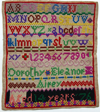 An unfinished sampler signed Dorothy Eleanor Airey, aged 14 in 1876; with alphabet and numbers.
