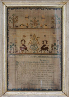 A framed sampler signed Mary Hanson 1821. Elaborately decorated including poetry, religious text, stags, dogs, birds, butterflies, squirrels, cherubs, trees and flowers.