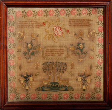A framed sampler signed Ann Hebden 1837. Intricate design, text, central design of tree and two stags, flowers, birds and floral border.