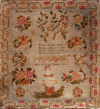 A sampler signed Eliza Cooper 1835, Miss B. Young's Seminary, Leeds, West Yorkshire. Religious text in centre surrounded by flowers, birds, girl carrying basket and  border of honeysuckle.